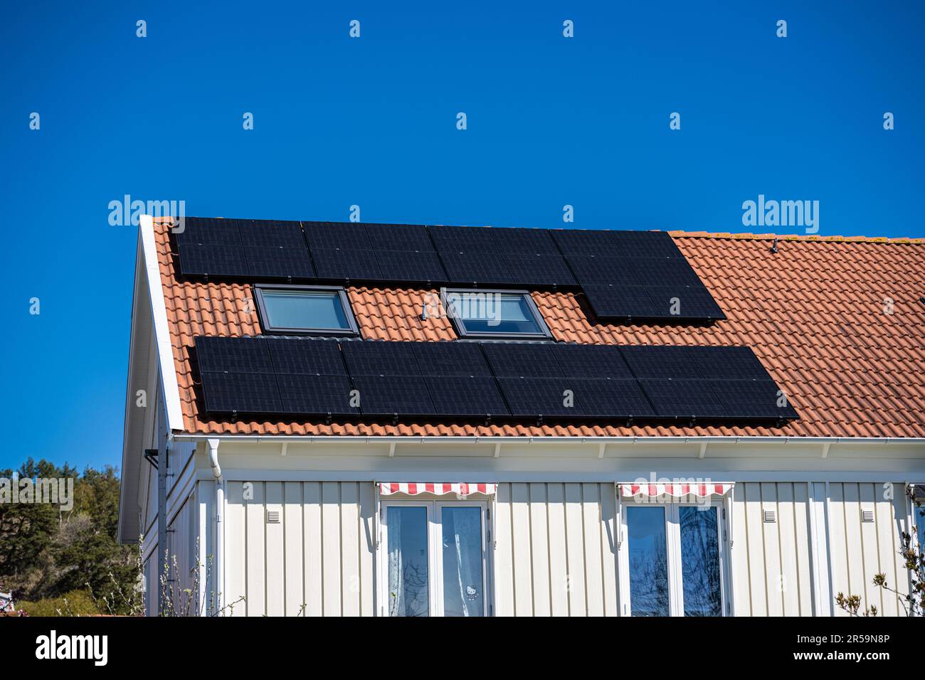 Solar cells mounten in the roof of a house Stock Photo - Alamy
