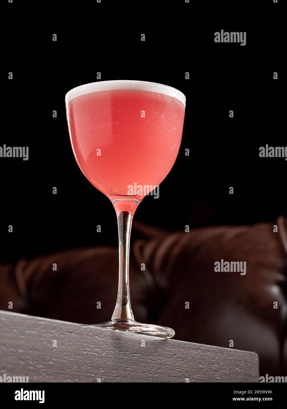 https://c8.alamy.com/comp/2R59N9K/luxury-cocktail-on-the-wooden-table-on-a-dark-background-2R59N9K.jpg