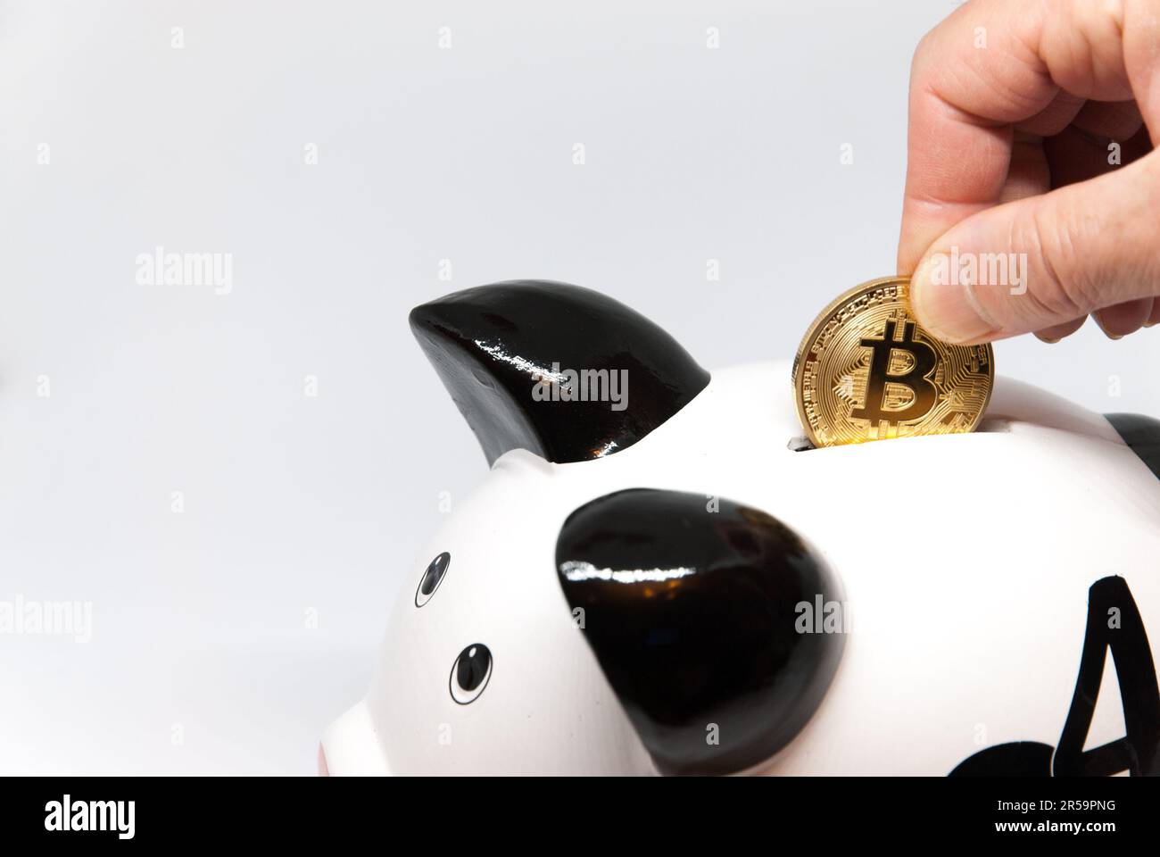 piggy bank and bitcoin concept coin investment for retirement pension or savings concept Stock Photo