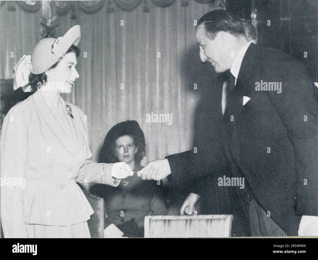 Princess Elizabeth (future Queen Elizabeth 2nd) being presented with a cheque for 21K by J Arthur Rank of the National Society for Prevention of Cruelty to Children (NSPCC) of which she is president on 1 June 1948, U.K. Stock Photo