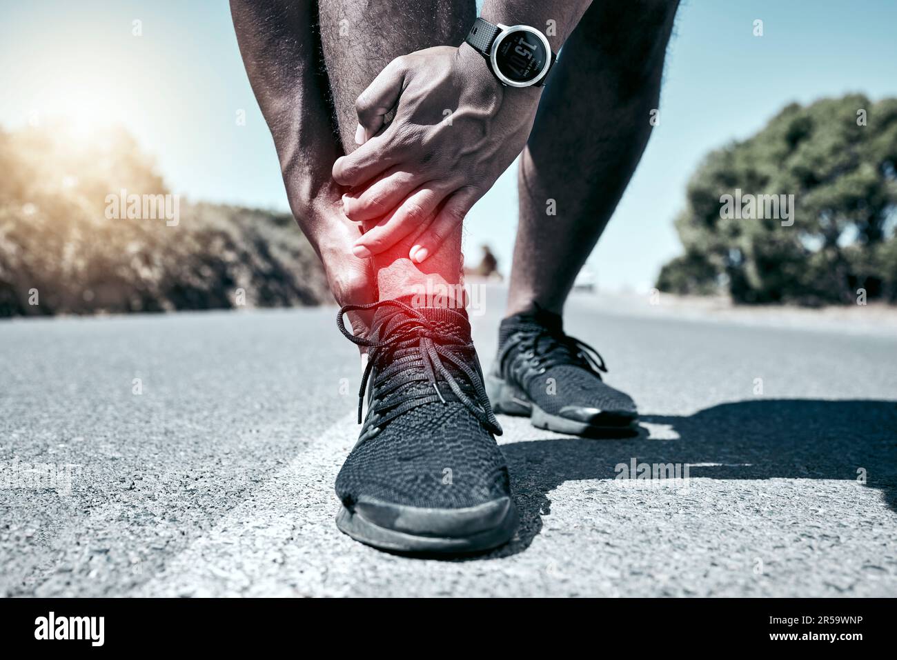 Fitness, ankle and accident with a sports man holding his joint in pain