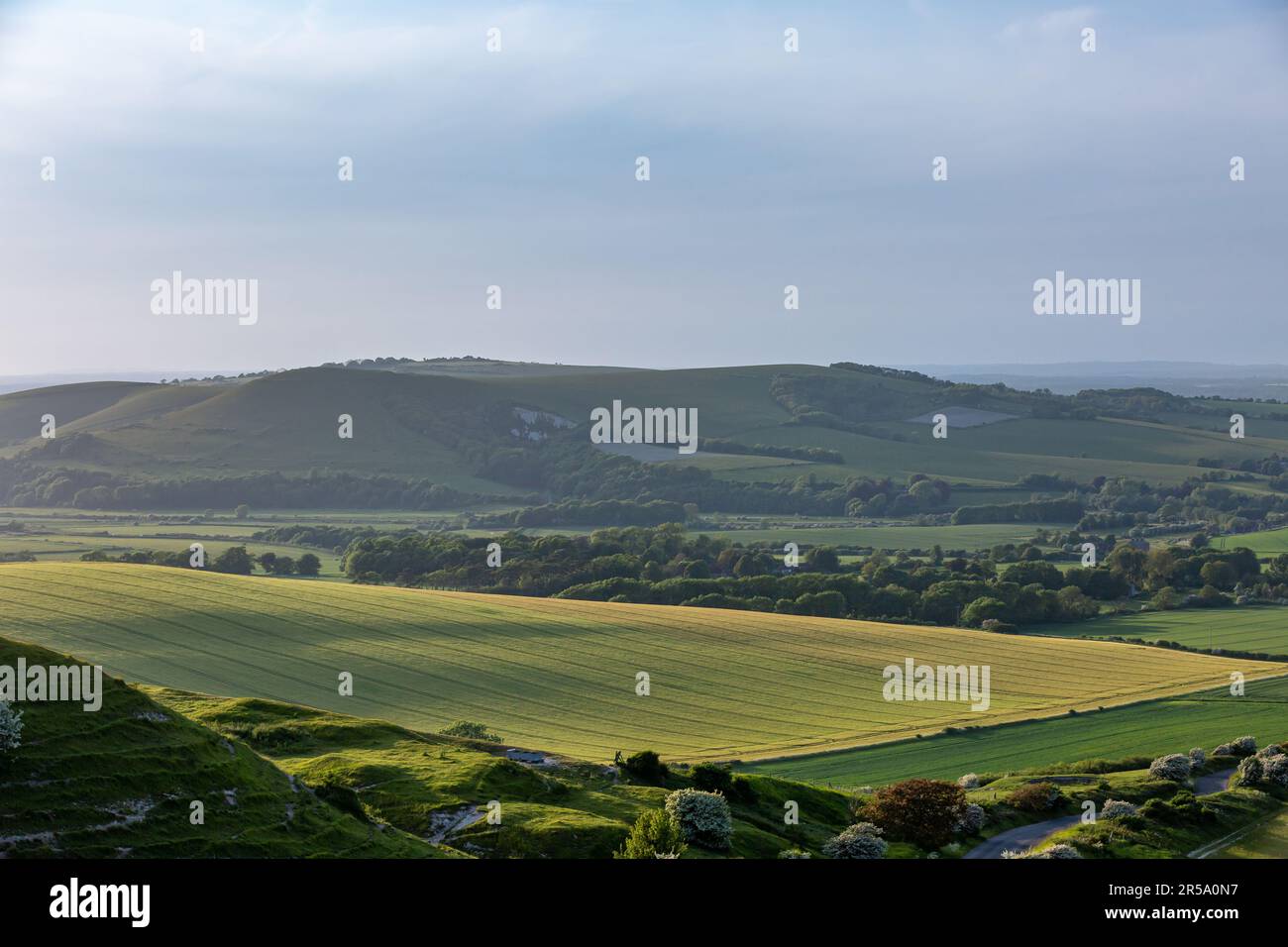 Looking out over fields and hills in the South Downs, from Firle Beacon Stock Photo