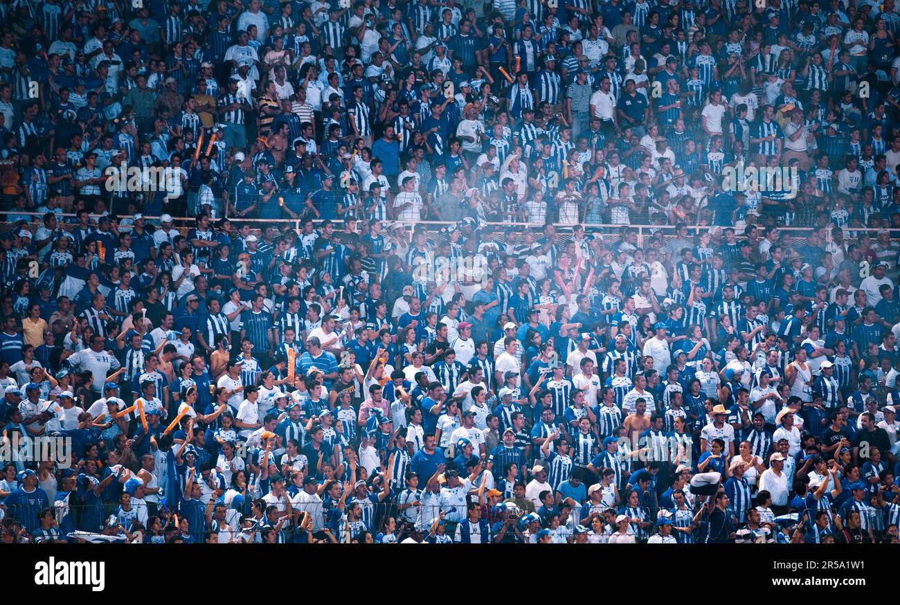 A stunned Honduran crowd watches as their team loses by one goal to the US team. Stock Photo
