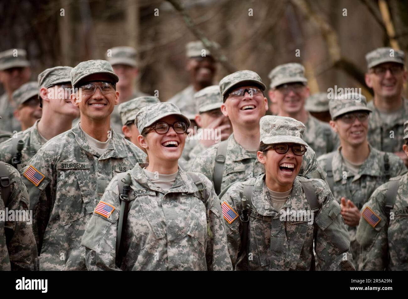 Soldiers in basic training laugh at their drill sergeant during a demonstration. Stock Photo