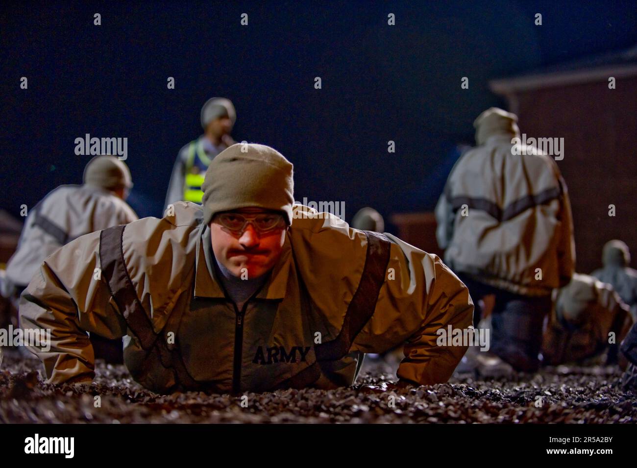 A soldier in basic training does push-ups during the physical training formation. Stock Photo