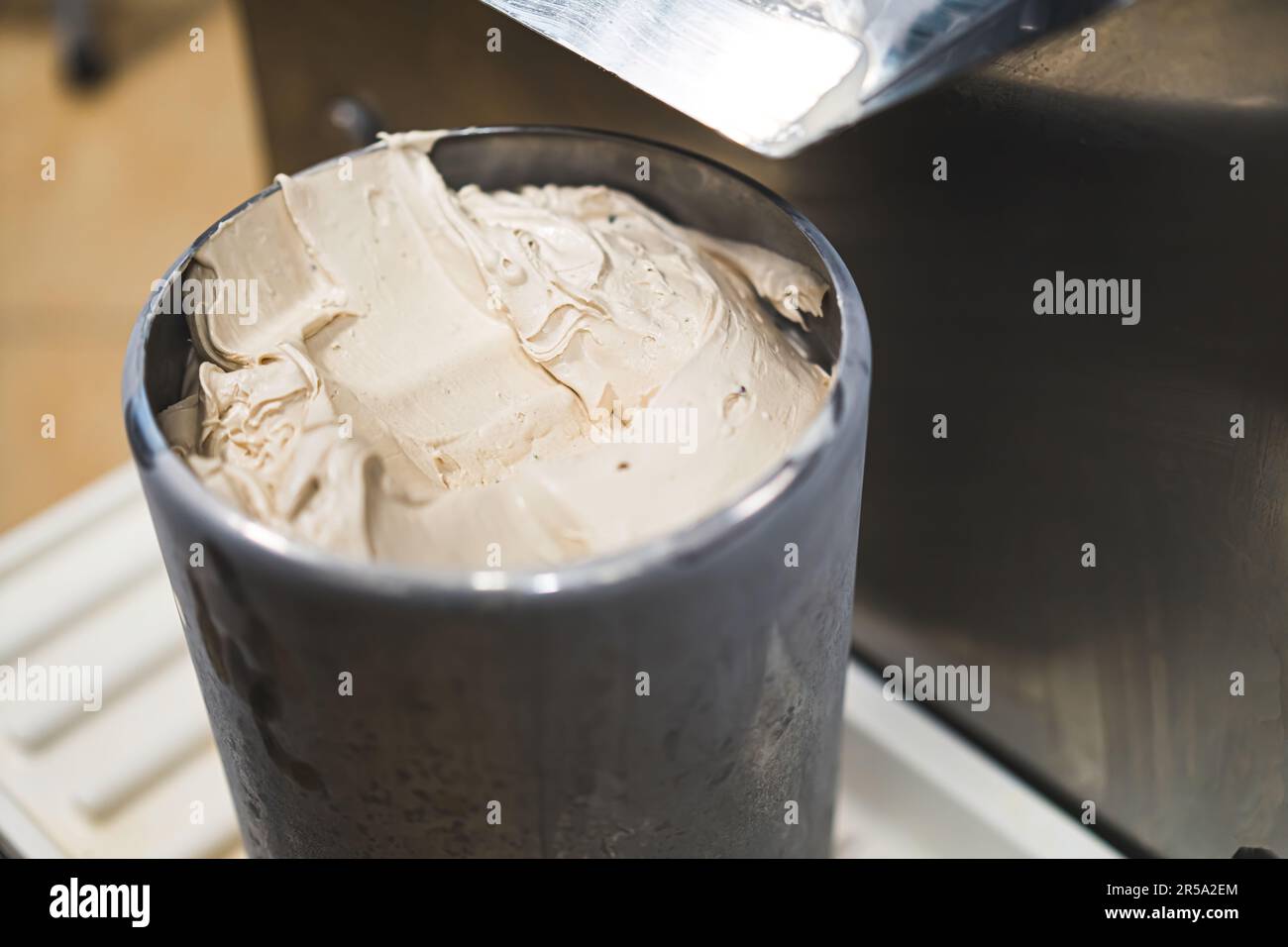 https://c8.alamy.com/comp/2R5A2EM/freshly-prepared-vanilla-ice-cream-in-steel-container-right-from-freezer-closeup-high-quality-photo-2R5A2EM.jpg