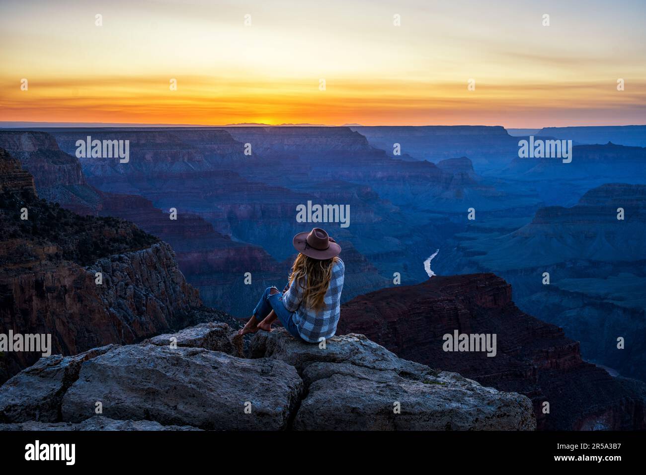 Blonde woman watching sunset hi-res stock photography and images - Alamy