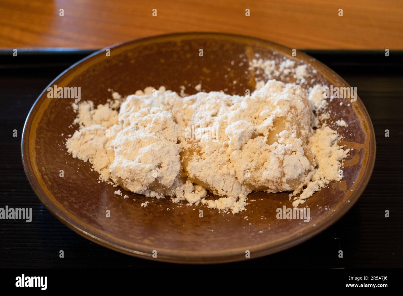 Abekawa Mochi, mochi dipped in hot water covered in sweetened yellow