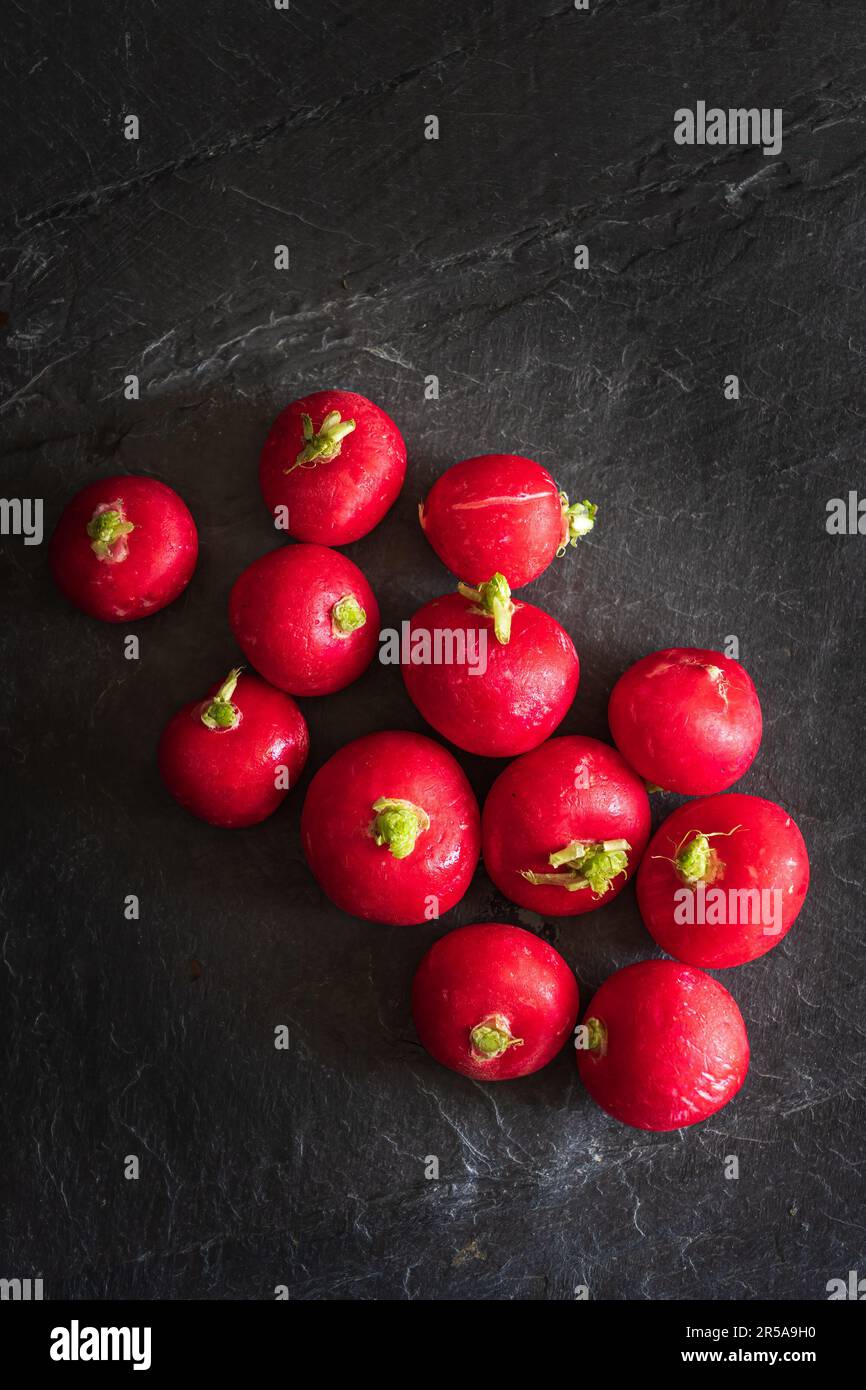 Radishes on a slate background Stock Photo
