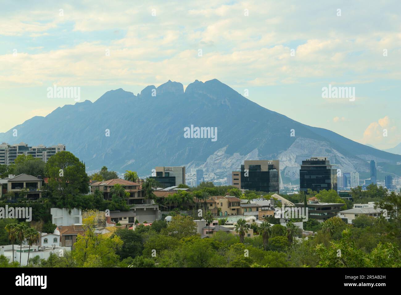 Beautiful landscape with city and green mountains Stock Photo