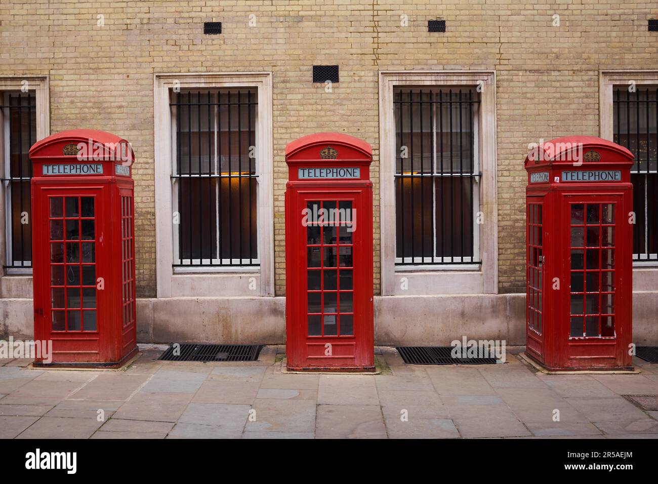 Three red booths on a row in Broad Court, Covent Garden, London, UK. Stock Photo