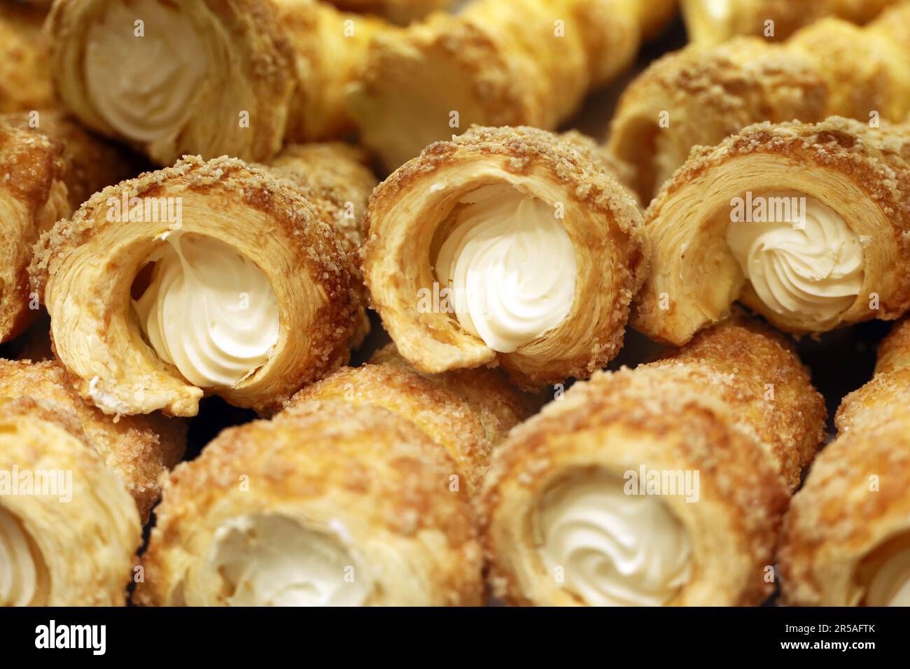 Rolls of puff pastry with cream. Sweet pastries for dessert Stock Photo