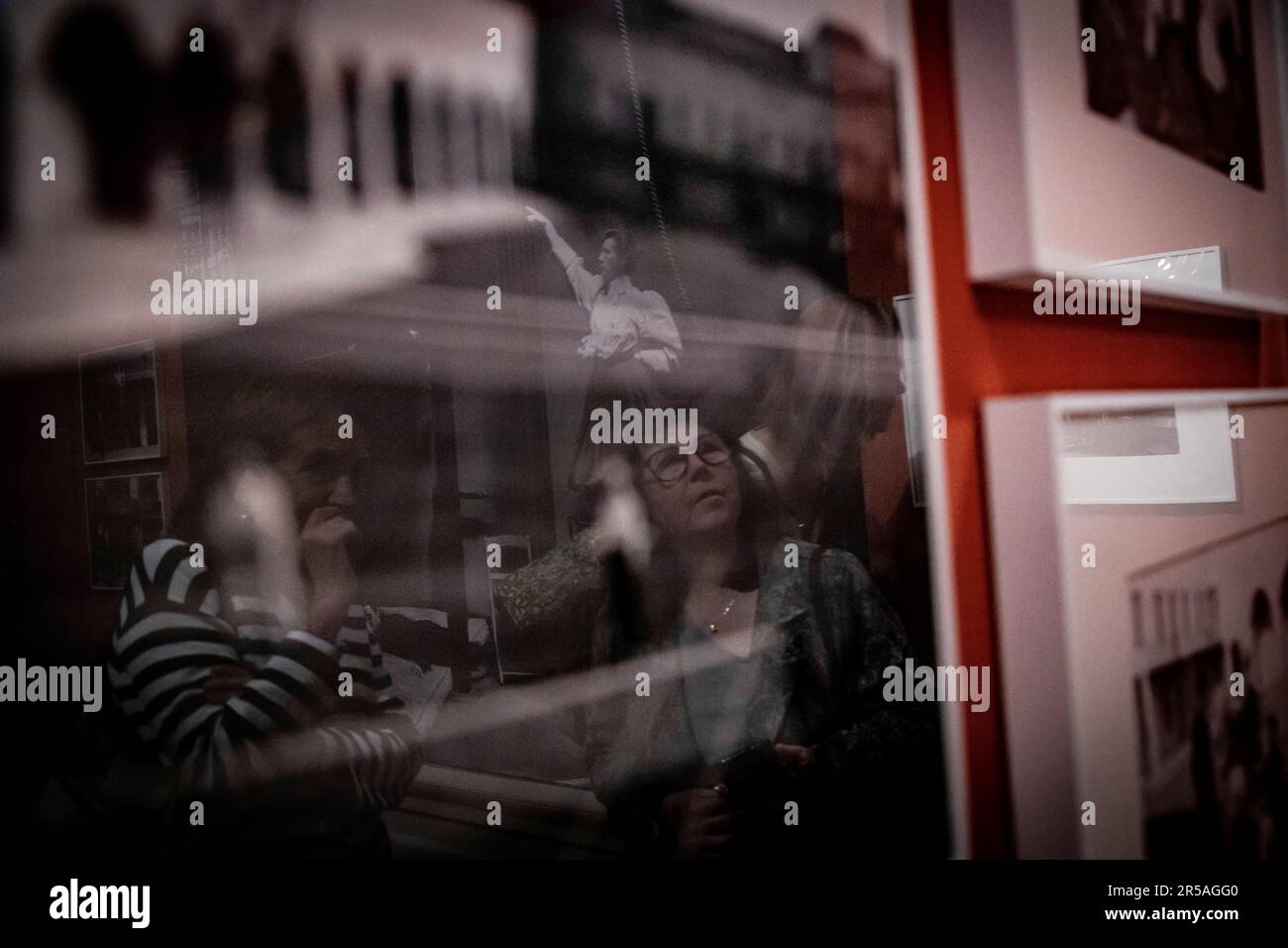 women converse in front of one of the works in the exhibition 'Alice Austen. Undoing Gender' at the Museo Nacional Romanticismo, June 2, 2023, in Madrid (Spain). Alice Austen