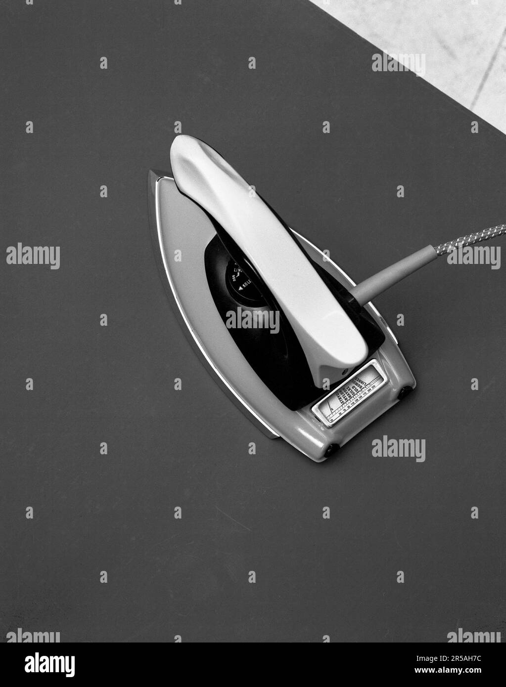 Ironing in the 1960s. Detail of a an electrical iron. Sweden 1963. Kristoffersson ref 373A-8 Stock Photo