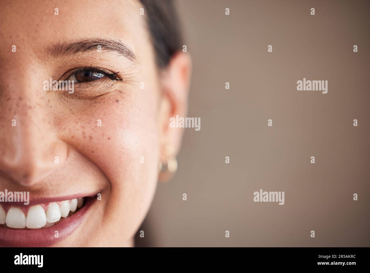 Portrait, closeup and woman with mockup, white teeth and smile against a studio background. Face, female person and girl with happiness, oral hygiene Stock Photo