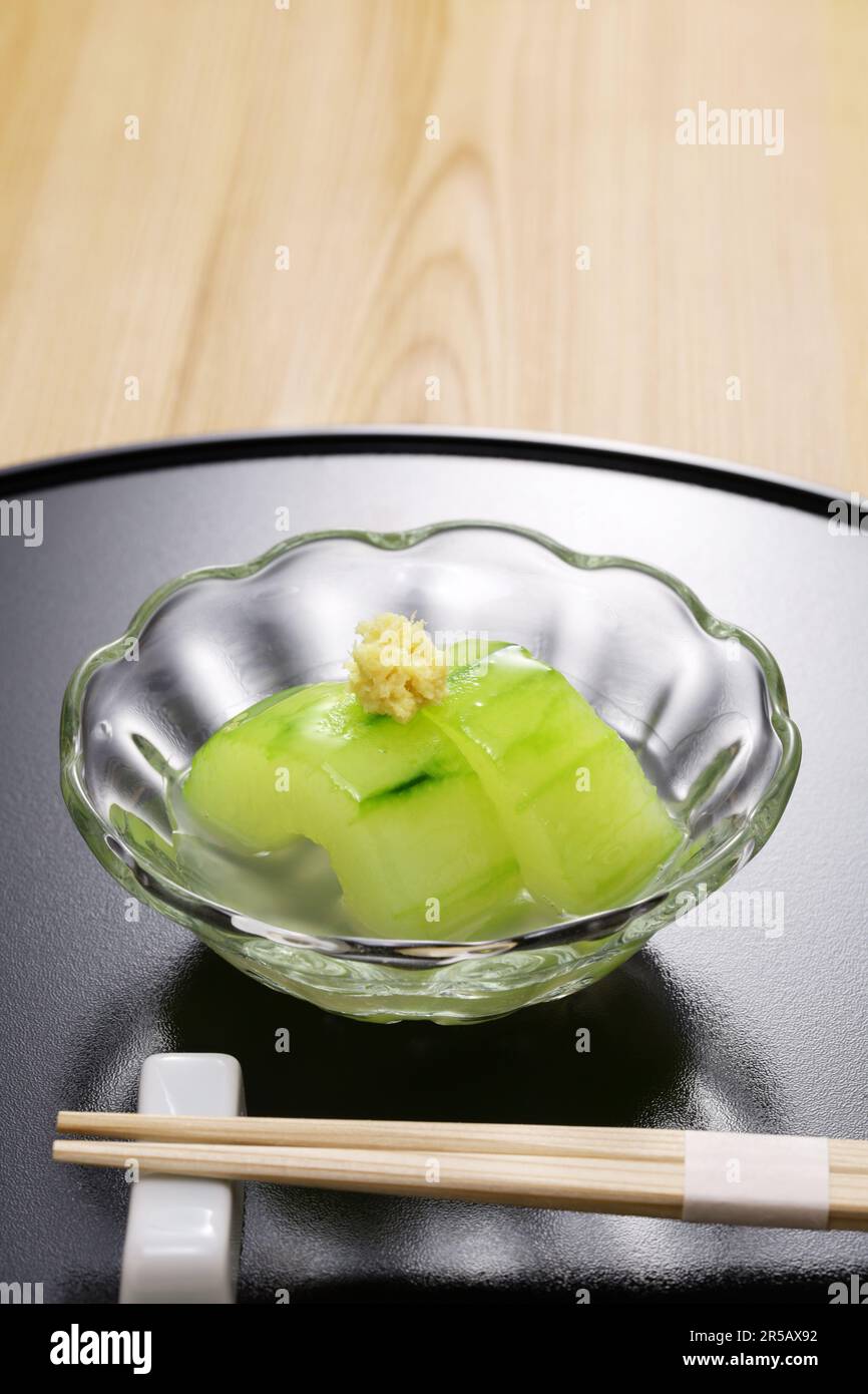 Jade color of simmered Kaga Futo cucumber with dashi broth, Japanese traditional cuisine Stock Photo