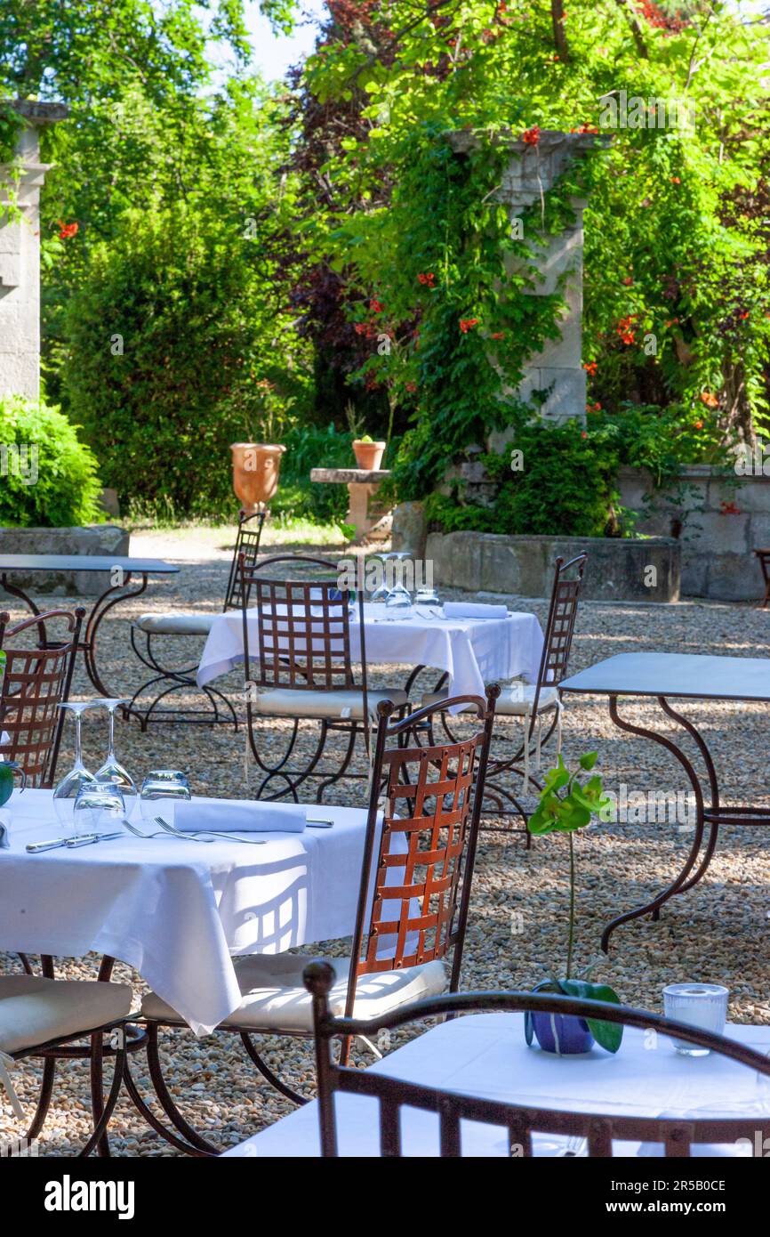 Tables set for dinner at Chateau Roussan near Saint Remy de-Provence, France Stock Photo