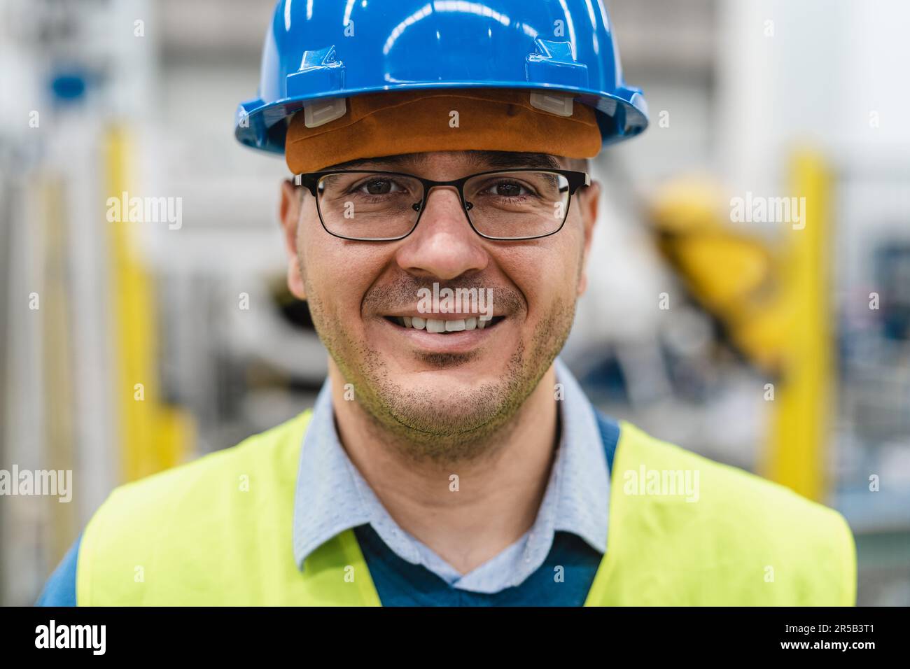 Engineer man working inside robotic factory - Automation industry concept Stock Photo