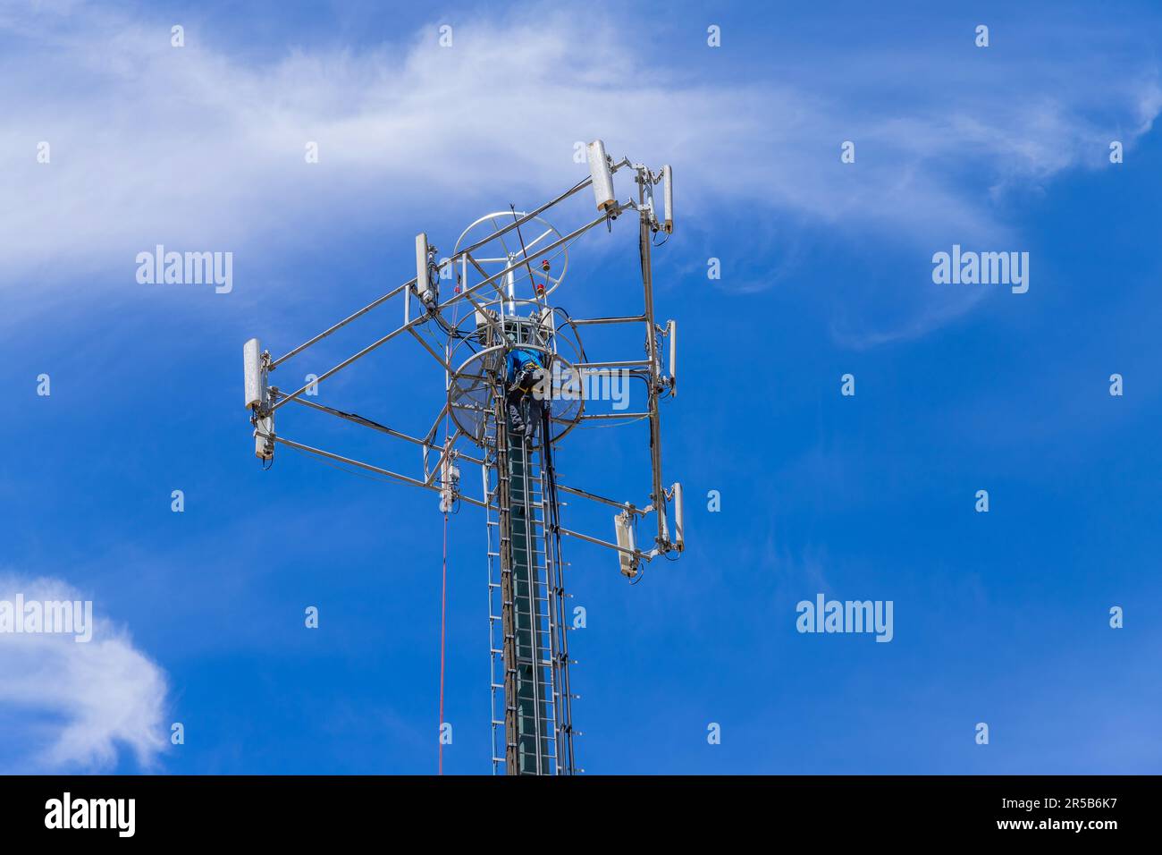 Fatima, Portugal: 30 April 2023: Working at a cellphone antenna tower for maintaining. technician worker repair telecommunication tower. Fatima, Portu Stock Photo