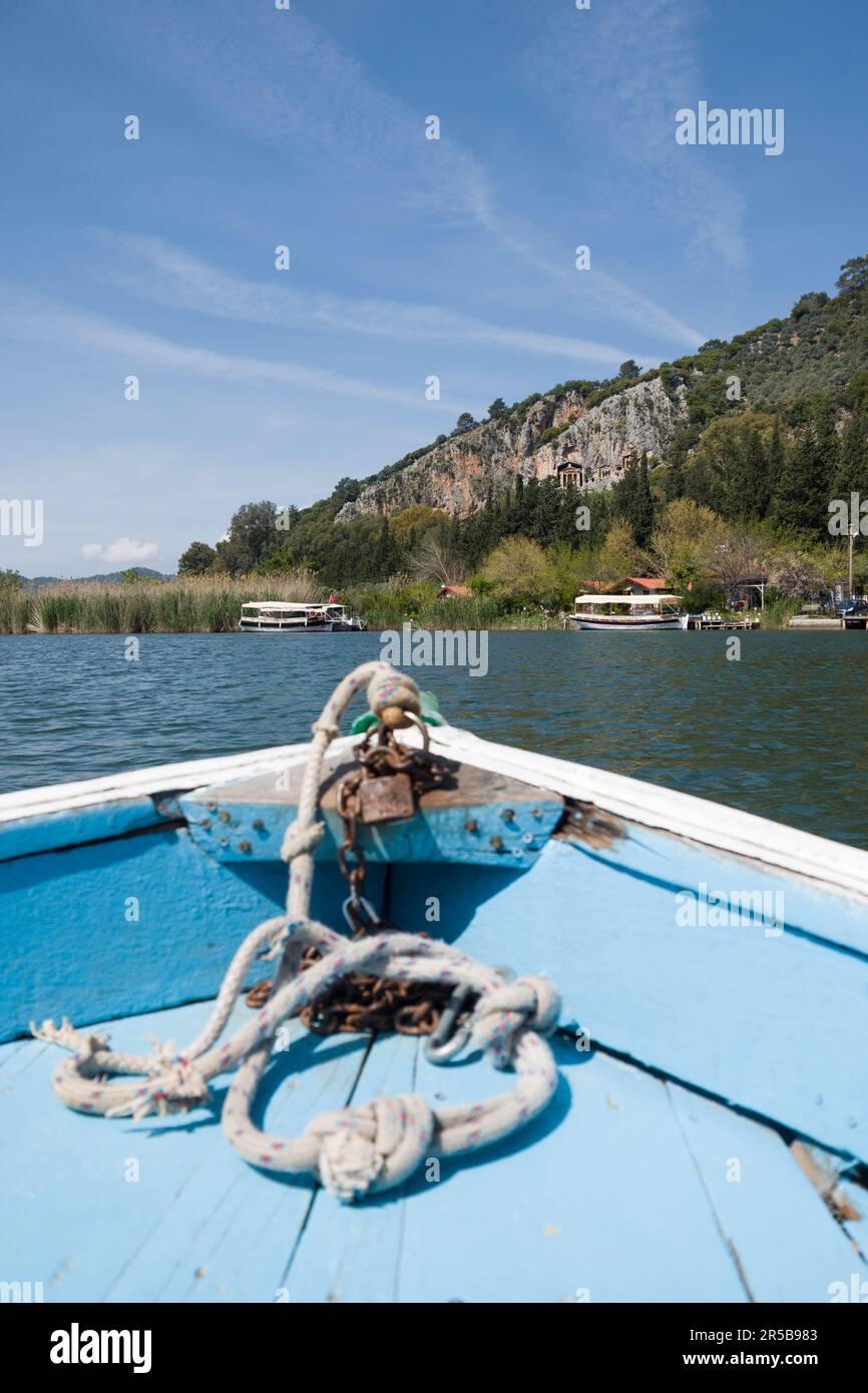 Lycian ancient rock tombs (4th century BC) viewed from a small boat on the Dalyan River, Dalyan, Muğla Province, Turkey, April 2023 Stock Photo