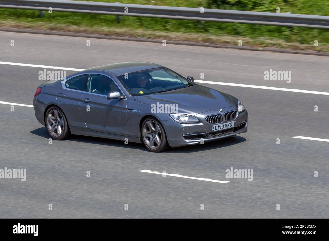 2013 BMW 640D SE Auto; travelling at speed on the M6 motorway in Greater Manchester, UK Stock Photo