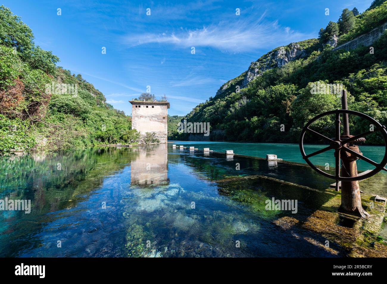 A scenic river winding its way through a lush landscape of wooded ...