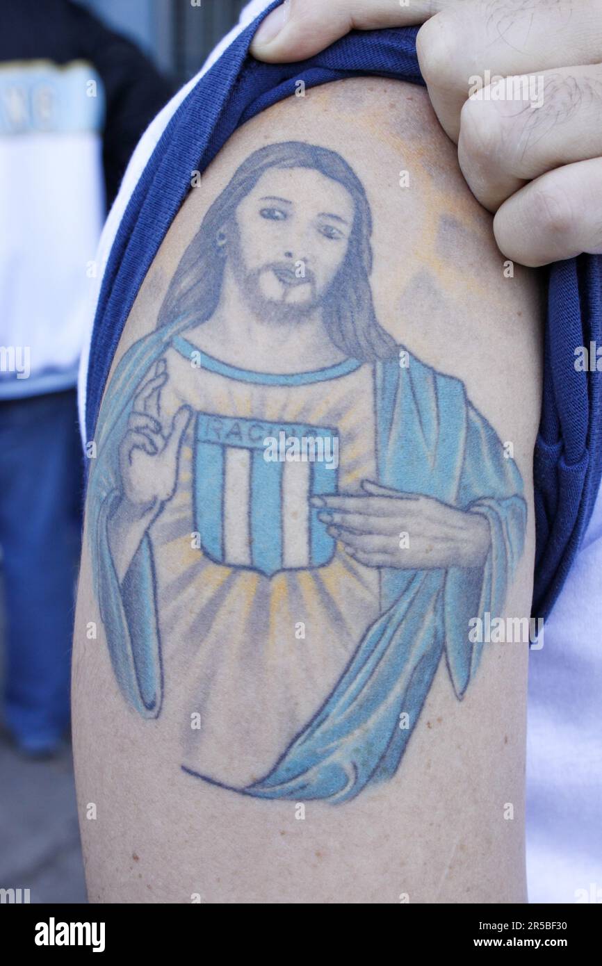 Avellaneda, Argentina, 2, October, 2011. A priest of the Catholic church shows his tattoo in the preview of the match between Racing Club and Club Atl Stock Photo