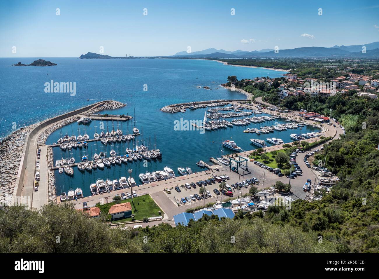 The port and the coast of Santa Maria Navarrese in Sardinia Stock Photo -  Alamy