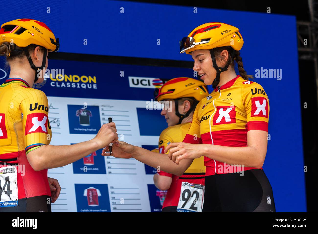 Uno X Pro Cycling Team signing in at Classique UCI Women's WorldTour road race Stage 3, 2023 Ford RideLondon. Elinor Barker, Amalie Lutro Stock Photo