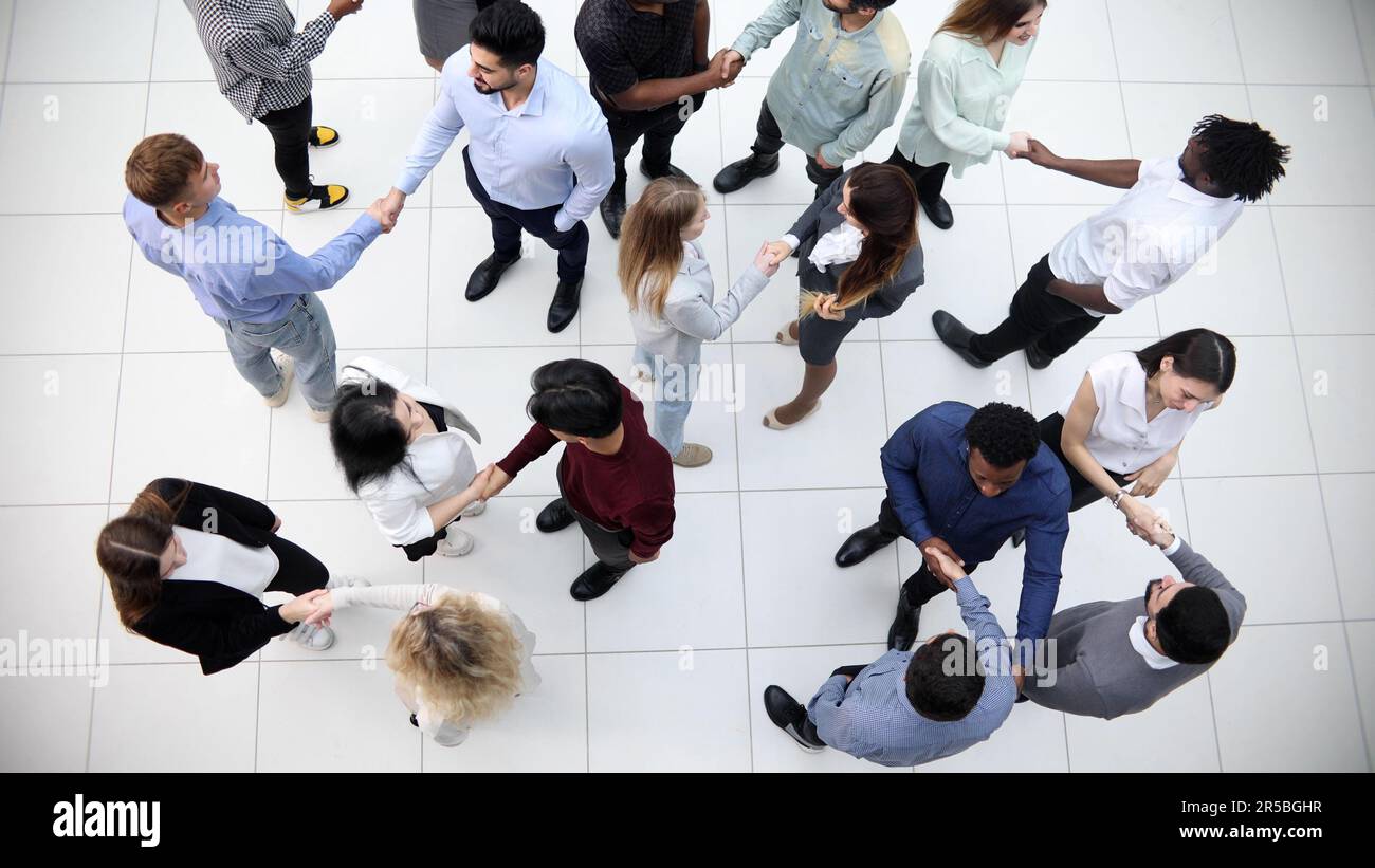 Group company confidently passes through the office hall Stock Photo