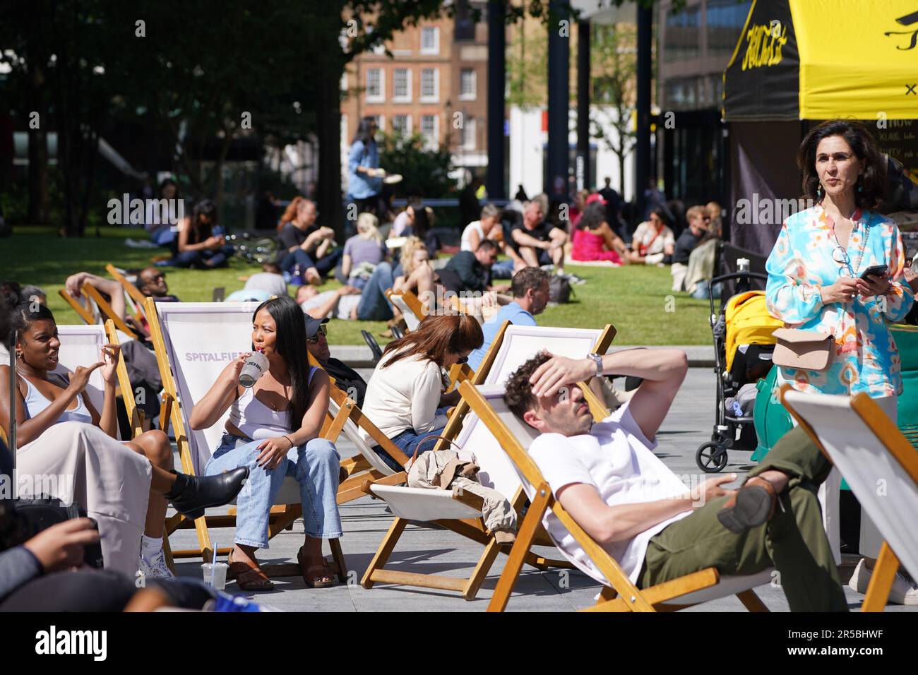 People enjoy the weather in Spitalfields, London, as temperatures across the UK are set to rise again next week and could reach a record-high for the year so far. Picture date: Friday June 2, 2023. Stock Photo