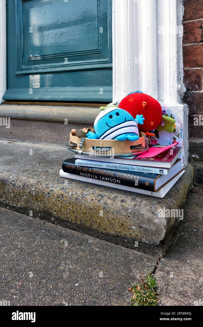 Items left out on house doorstep free for collection by anyone who wants or needs the items. England UK Stock Photo