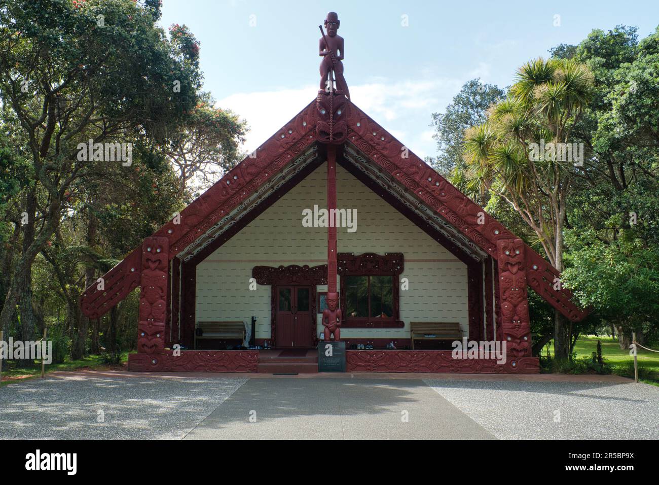 A red building with traditional Maori patterns. Waitangi Treaty Grounds, New Zealand. Stock Photo