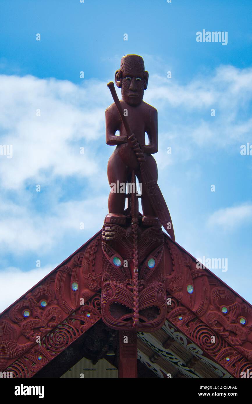 A traditional Maori statue on the roof. Waitangi Treaty Grounds, New Zealand. Stock Photo