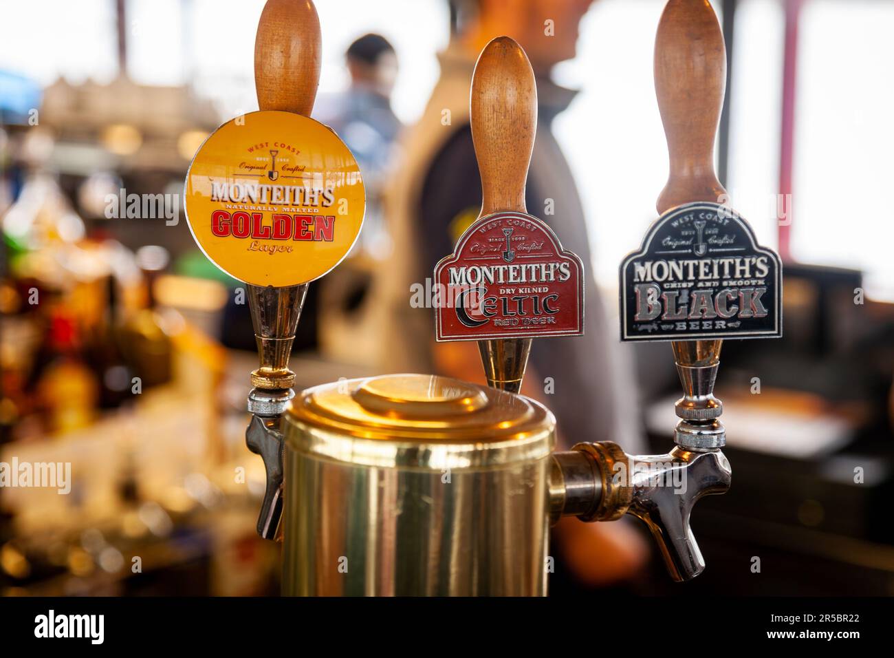 Queenstown, New Zealand - Jan 10, 2010: Monteith's Brewery Company draft beer taps at Real Journeys touristic steamship TSS Earnslaw bar Stock Photo