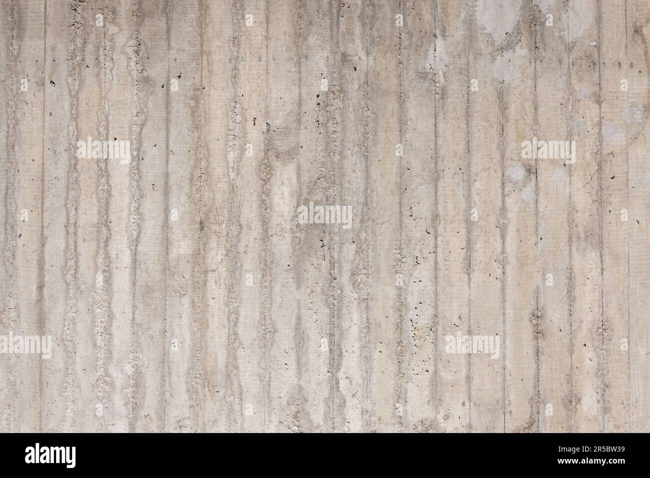 Fair Faced Concrete Wall with Vertical Wood Linings Imprints Stock Photo