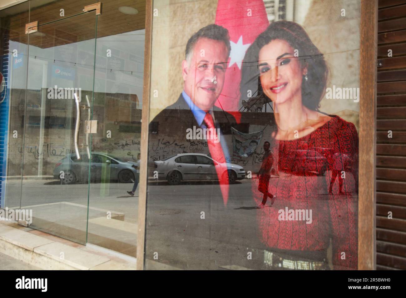 Nablus, Palestine. 02nd June, 2023. View of a poster of King Abdullah II of Jordan and his wife Queen Rania on a Palestinian store, during the occasion of their son Prince Hussein's wedding, in the middle of the market in the city of Nablus, north of the occupied West Bank (Photo by Nasser Ishtayeh/SOPA Images/Sipa USA) Credit: Sipa USA/Alamy Live News Stock Photo