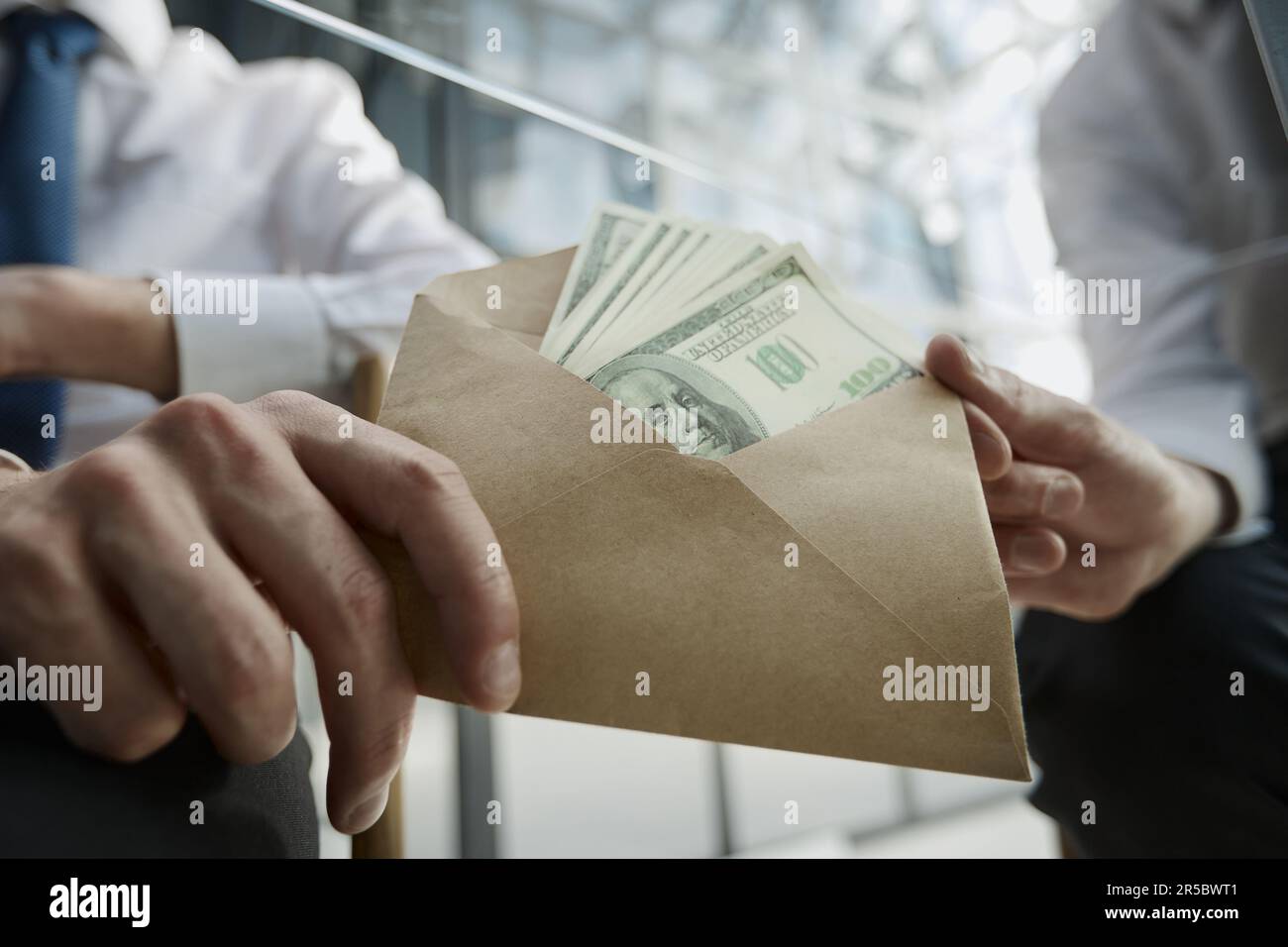 Transfer of money in an envelope in men Stock Photo Alamy