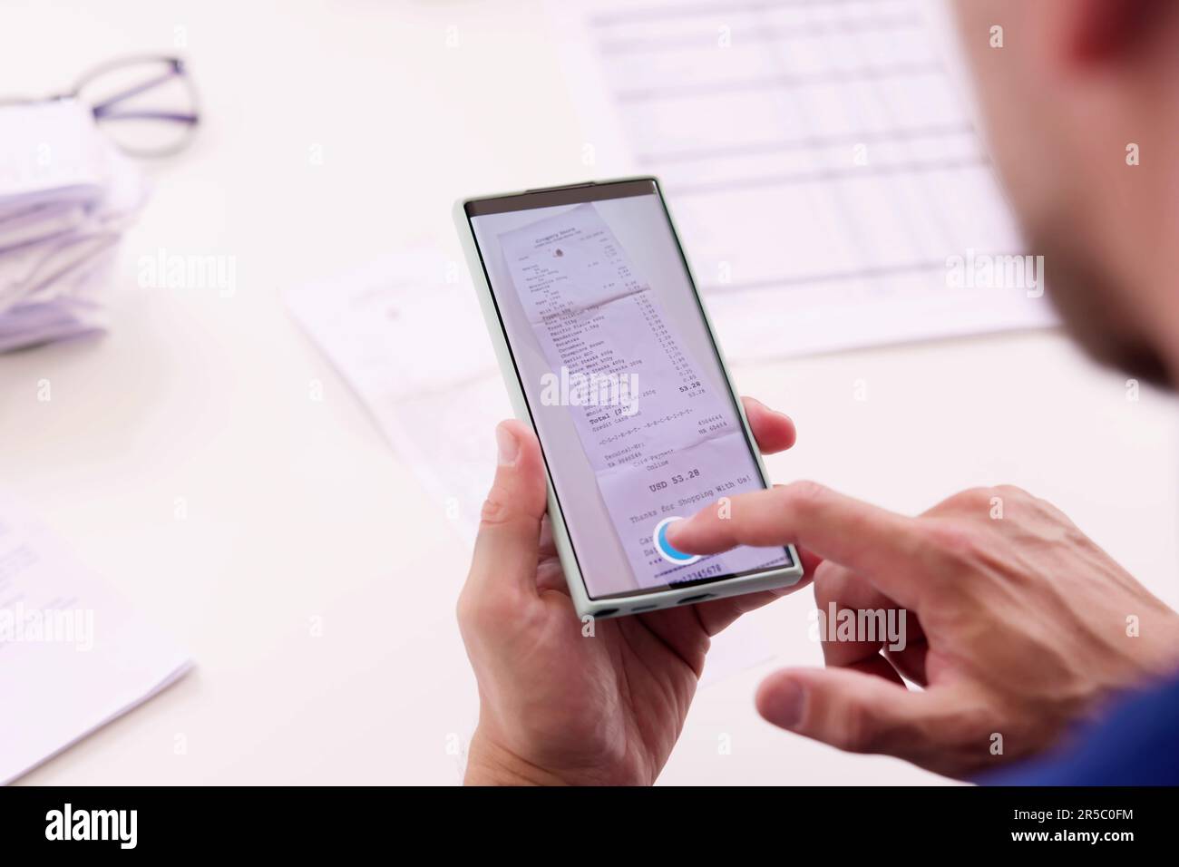Taking Receipt Document Photo Using Phone Or Smartphone Stock Photo
