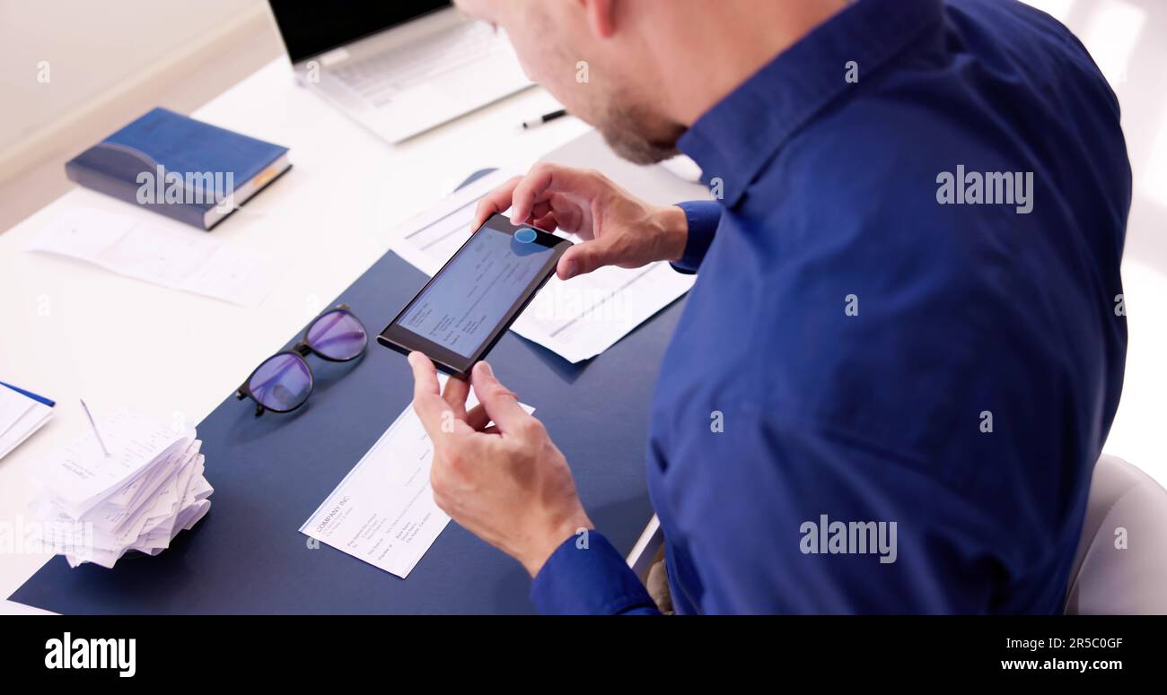 Scanning Remote Deposit Check Document Using Phone. Taking Photo Stock Photo