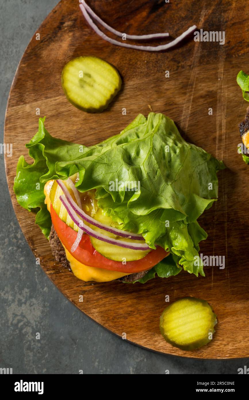 Gluten Free Paleo Bunless Cheeseburger with Lettuce and Tomato Stock