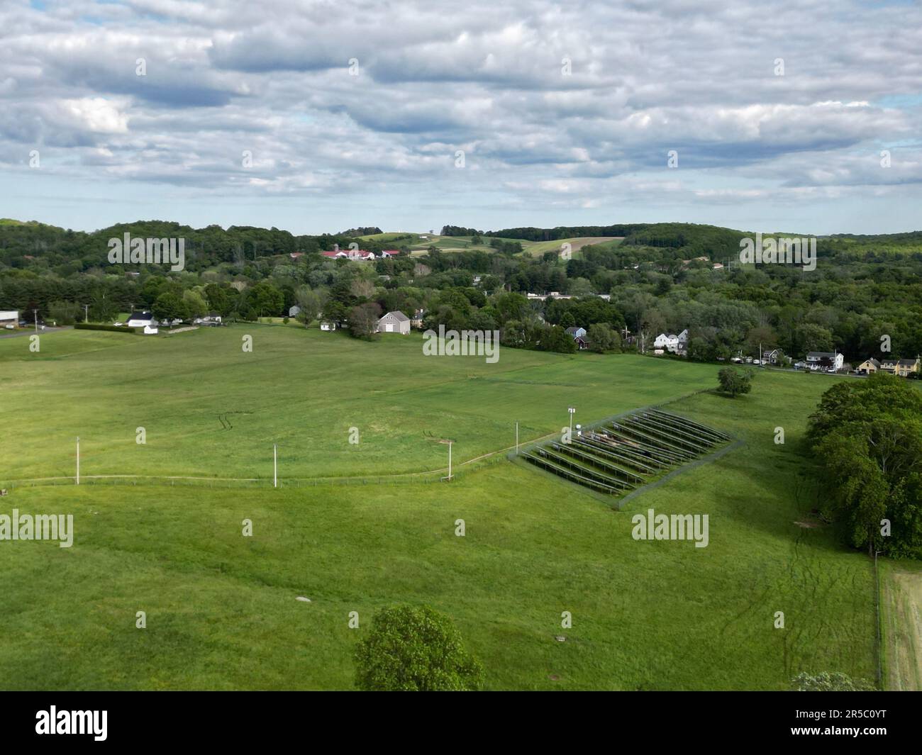 An aerial view of a rural agricultural landscape featuring multiple
