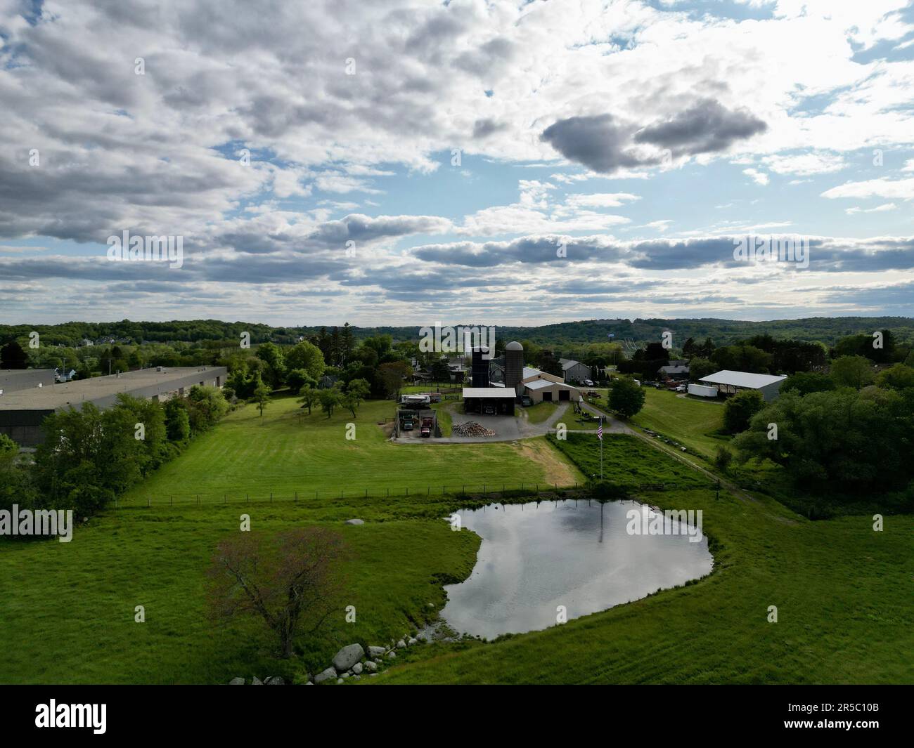 An aerial view of a rural agricultural landscape featuring multiple