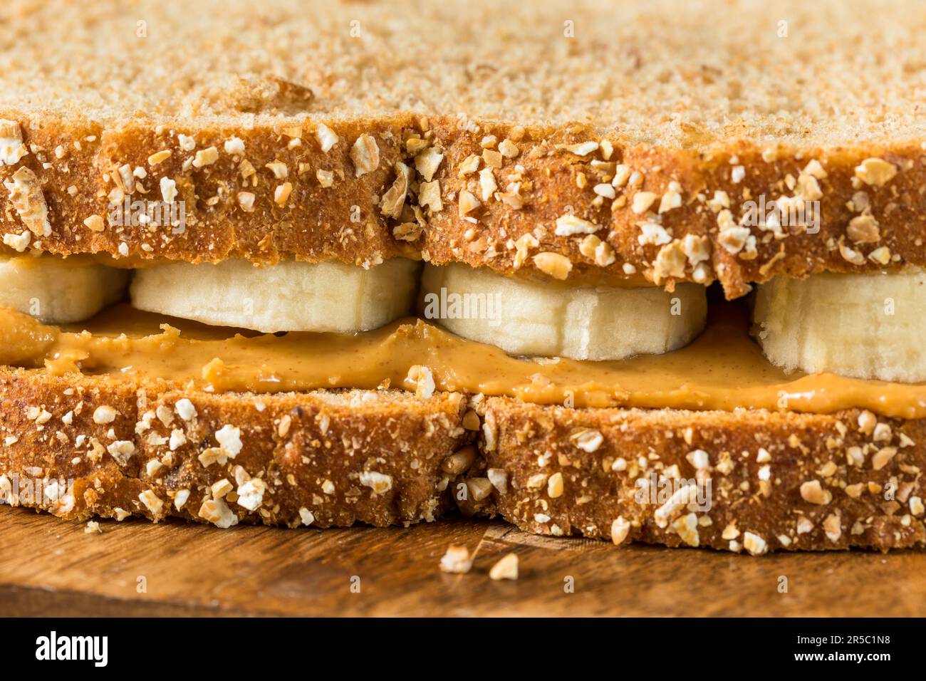 Homemade Healthy Peanut Butter Banana Sandwich on Wheat Bread Stock