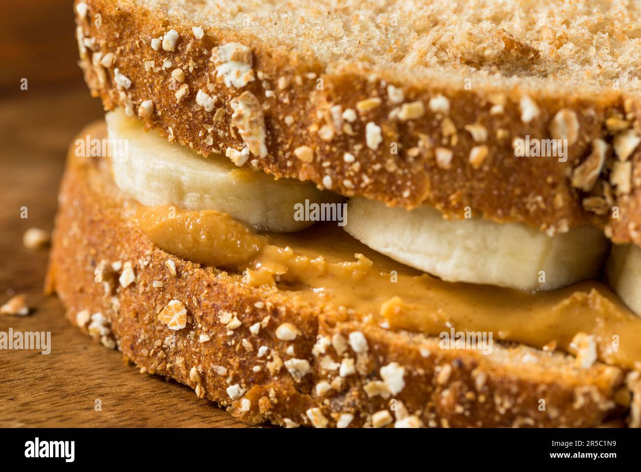 Homemade Healthy Peanut Butter Banana Sandwich on Wheat Bread Stock
