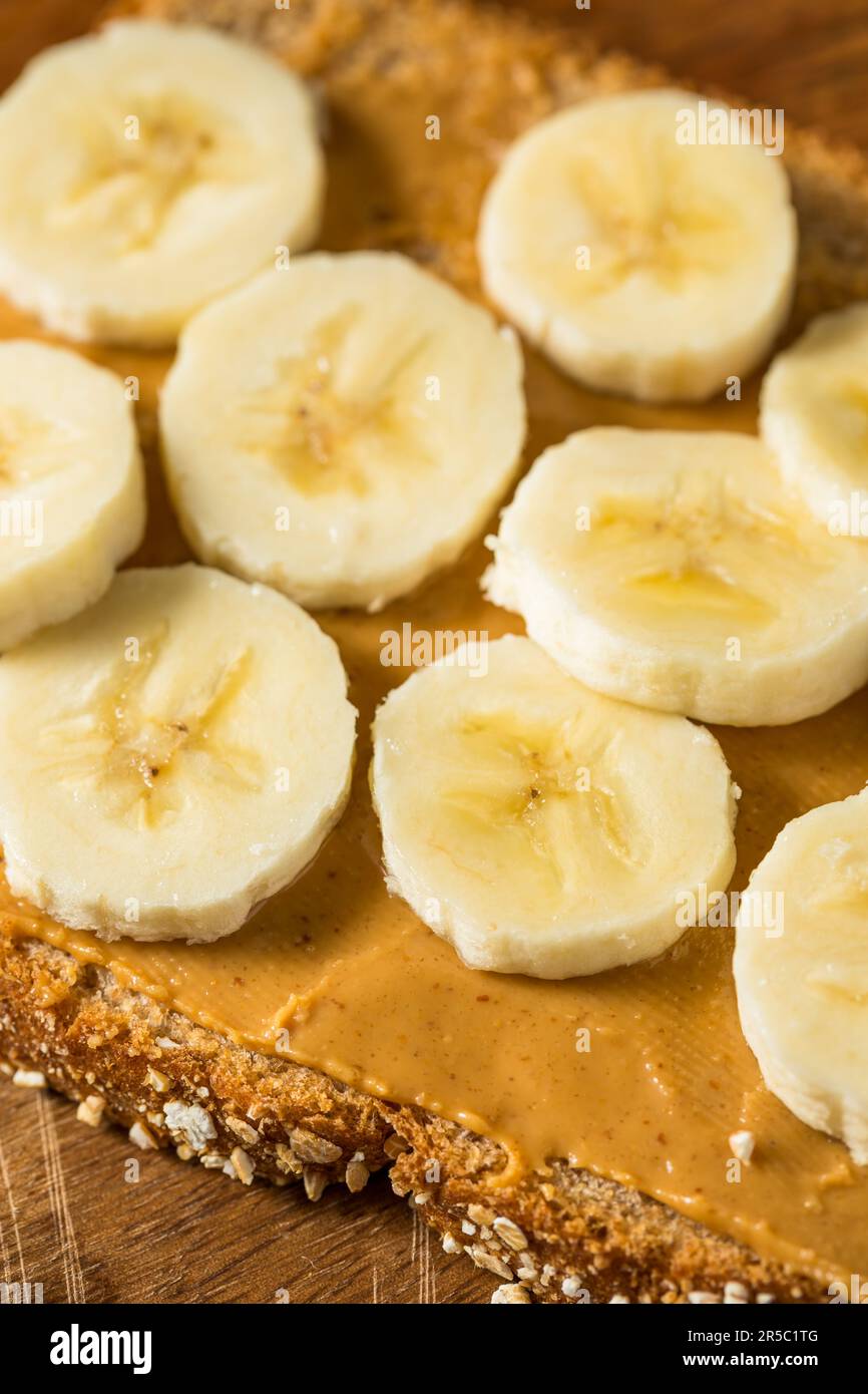 Homemade Healthy Peanut Butter Banana Sandwich on Wheat Bread Stock