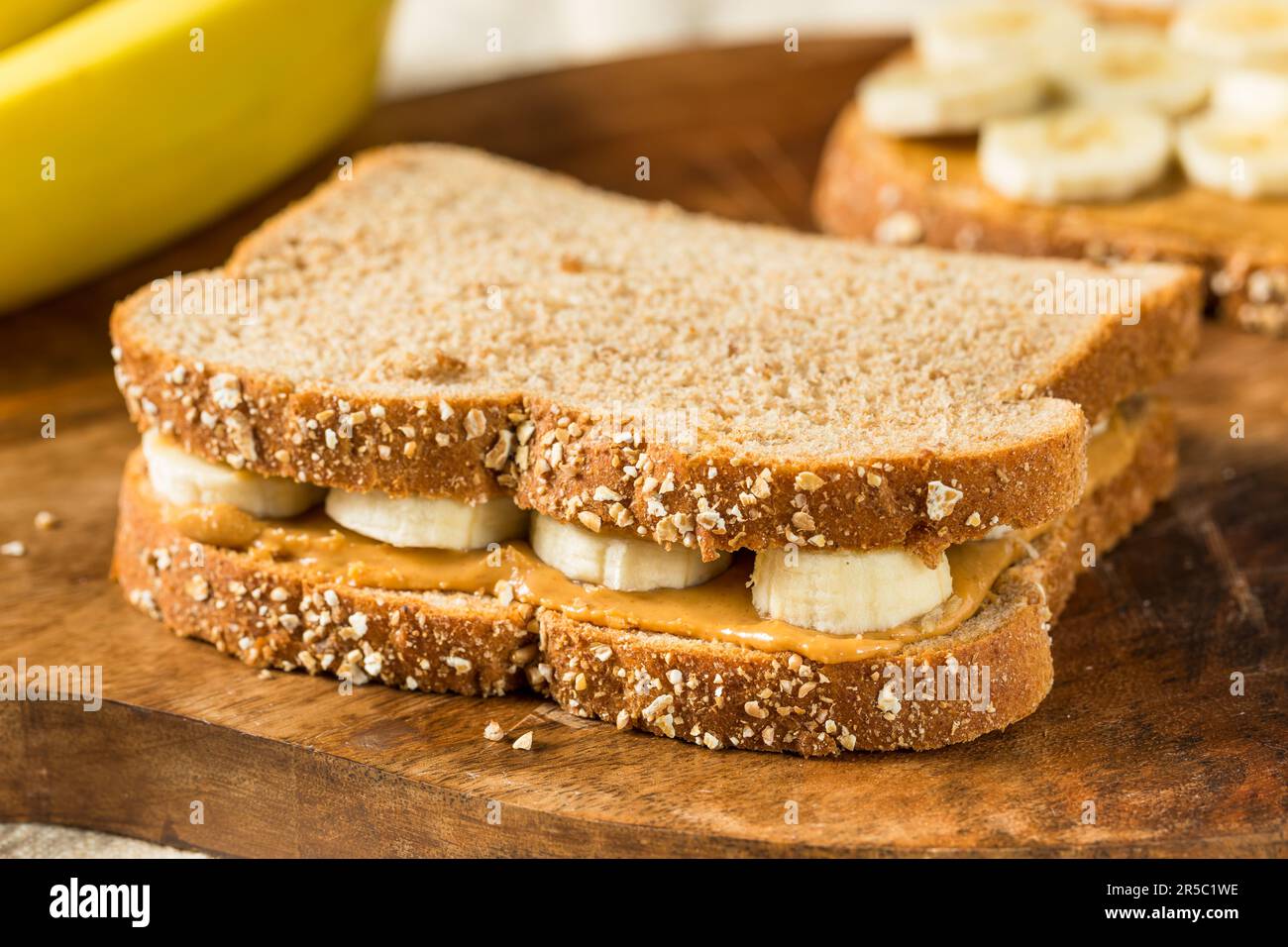 Homemade Healthy Peanut Butter Banana Sandwich on Wheat Bread Stock