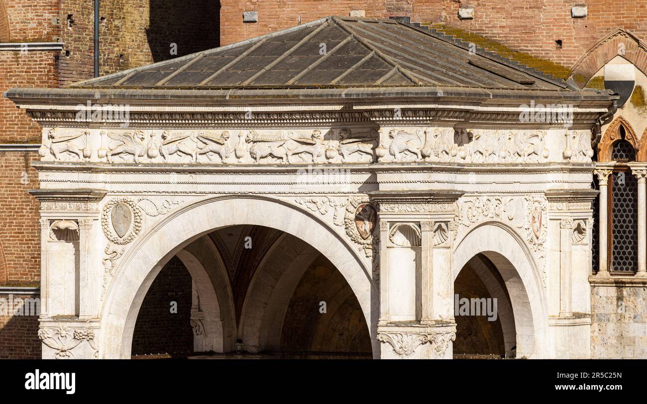 Siena, Siena Province, Tuscany, Italy.  Detail of the portico to the Palazzo Pubblico, showing the frieze.  The historic centre of Siena is a UNESCO W Stock Photo