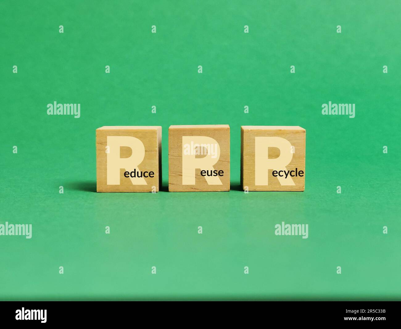 A set of small wooden cubes with the words reduce, reuse, and recycle ...