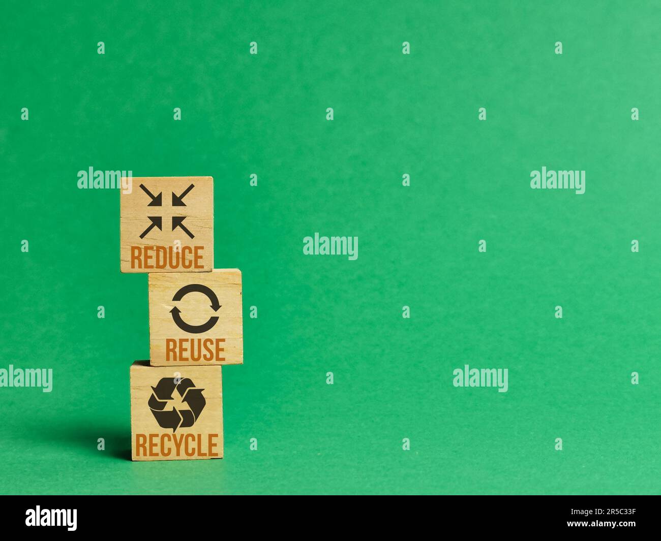 A set of small wooden cubes with the words reduce, reuse, and recycle ...